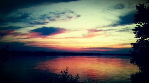 Scenic view of lake against sky during sunset