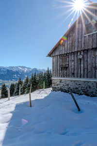 House on snow covered landscape