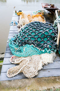 High angle view of fishing net on pier