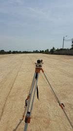 Man working on field against sky