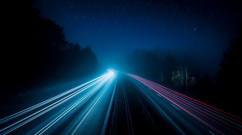 High angle view of light trails on road at night