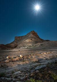 Low angle view of mountain against clear blue sky