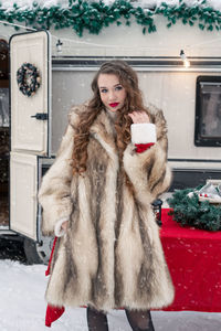 Portrait of young woman wearing warm clothing