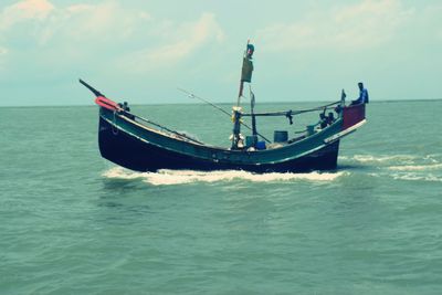 Boat in sea against sky