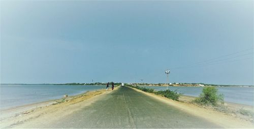 Scenic view of beach against clear sky