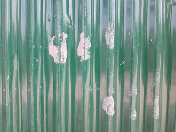 Full frame shot of wood with reflection in background