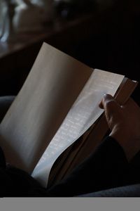 Close-up of hand on paper