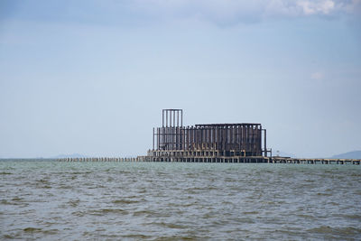 Pier over sea against sky