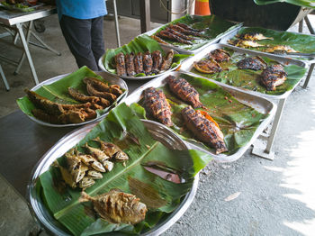 High angle view of malaysian tradisional fish menu on table.