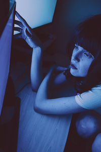 High angle portrait of boy sitting at home