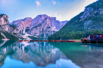 Scenic view of lake and mountains against sky