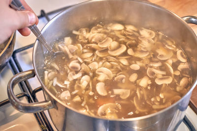 Close-up of person preparing food in kitchen