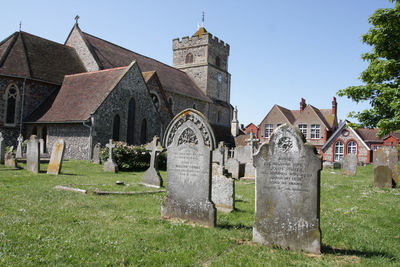 View of cemetery against buildings