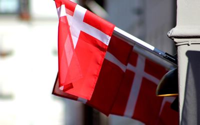 Close-up of flags hanging against the wall