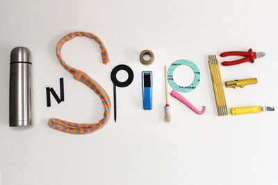 Inspire text made of various tools on white background