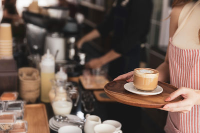 Close-up of coffee served on table at cafe