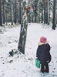 Full length of child on snow covered land