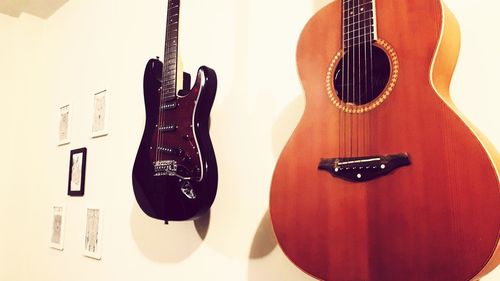 Close-up of guitar against white background