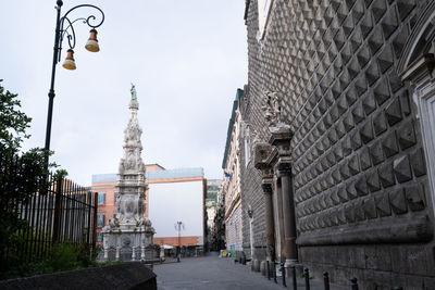 Street amidst buildings against sky