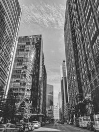 Street amidst buildings against sky