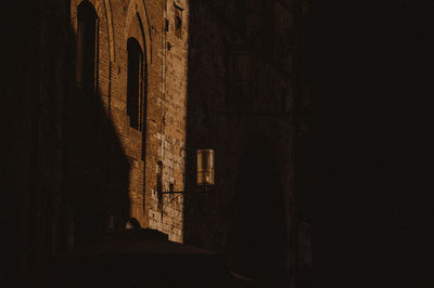 Shadow of window on wall of building at night