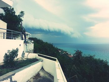 Scenic view of sea against cloudy sky
