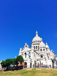 Low angle view of church against blue sky