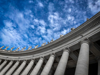 Low angle view of building against cloudy sky