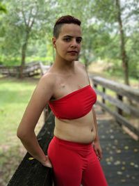 Portrait of young woman standing outdoors