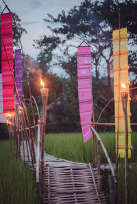 Close-up of illuminated lighting equipment on field
