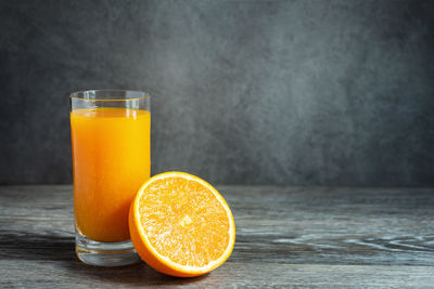 Orange juice in glass on table