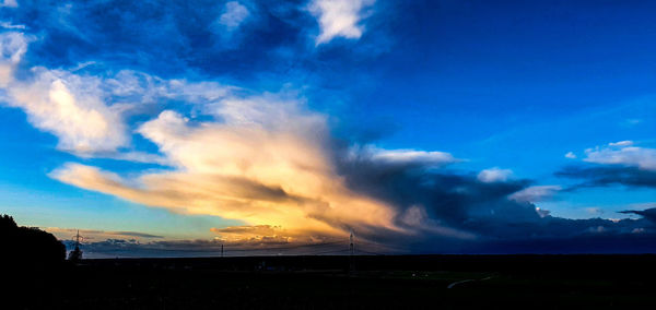 Scenic view of dramatic sky over land