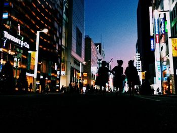 Buildings in city at night