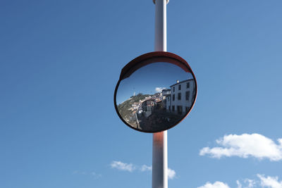 Village of lastres reflected in a convex mirror