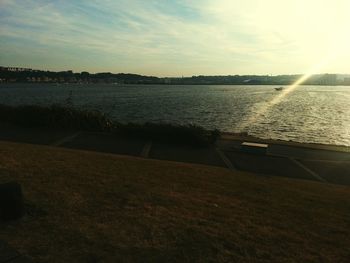 Scenic view of river at sunset