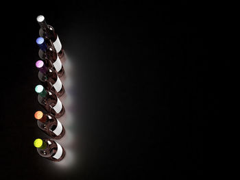 High angle view of illuminated lighting equipment against black background