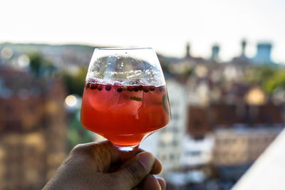 Close-up of hand holding drink