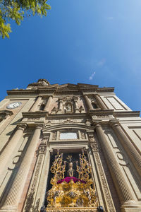 Low angle view of building against blue sky