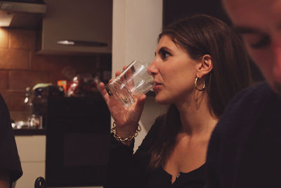 Young woman drinking glass