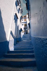 High angle view of steps amidst buildings
