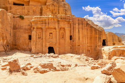 Ancient tomb of roman soldier and funeral ballroom carved in sandstone rock, petra, jordan