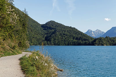 Scenic view of mountains against blue sky