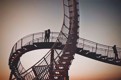 Low angle view of people walking on stairs