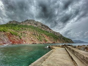 Scenic view of sea against cloudy sky