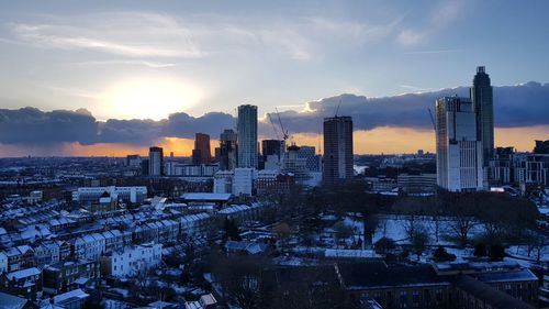 Cityscape against sky during sunset