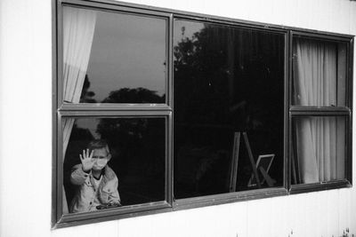 Boy seen through window