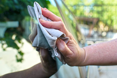 Close-up of people holding hands
