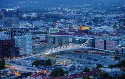 High angle view of illuminated city buildings at night