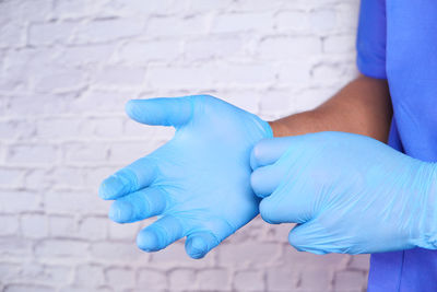 Close-up of human hand on wall