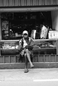 Full length portrait of man sitting